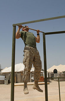 A U.S. marine performing a pull-up